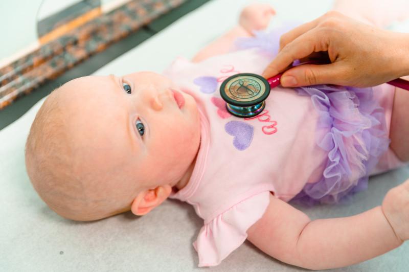 a baby with a stethoscope on its chest